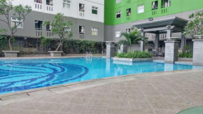 Homey and Comfort 2BR Green Pramuka City Apartment By Travelio